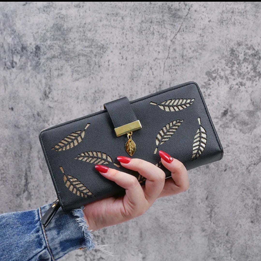 LADDIES HALLOWED OUT LEAVES FASHION PURSES.