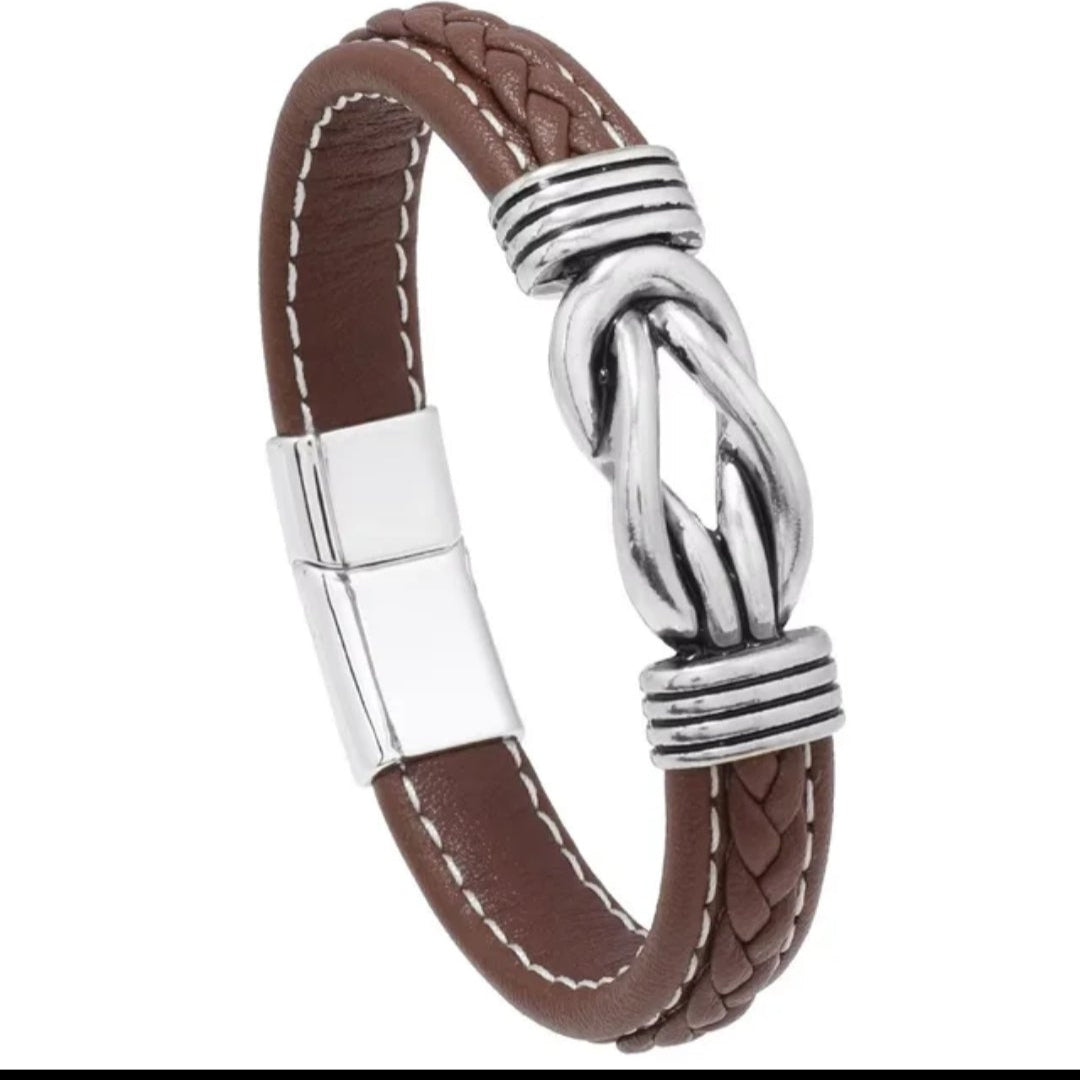 Brown leather bracelet with silver clasp on a white background