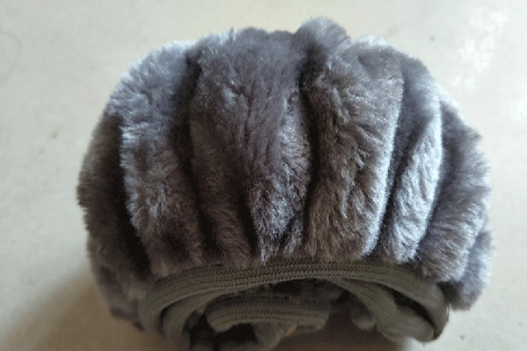 Gray textured scrubber on a light background
